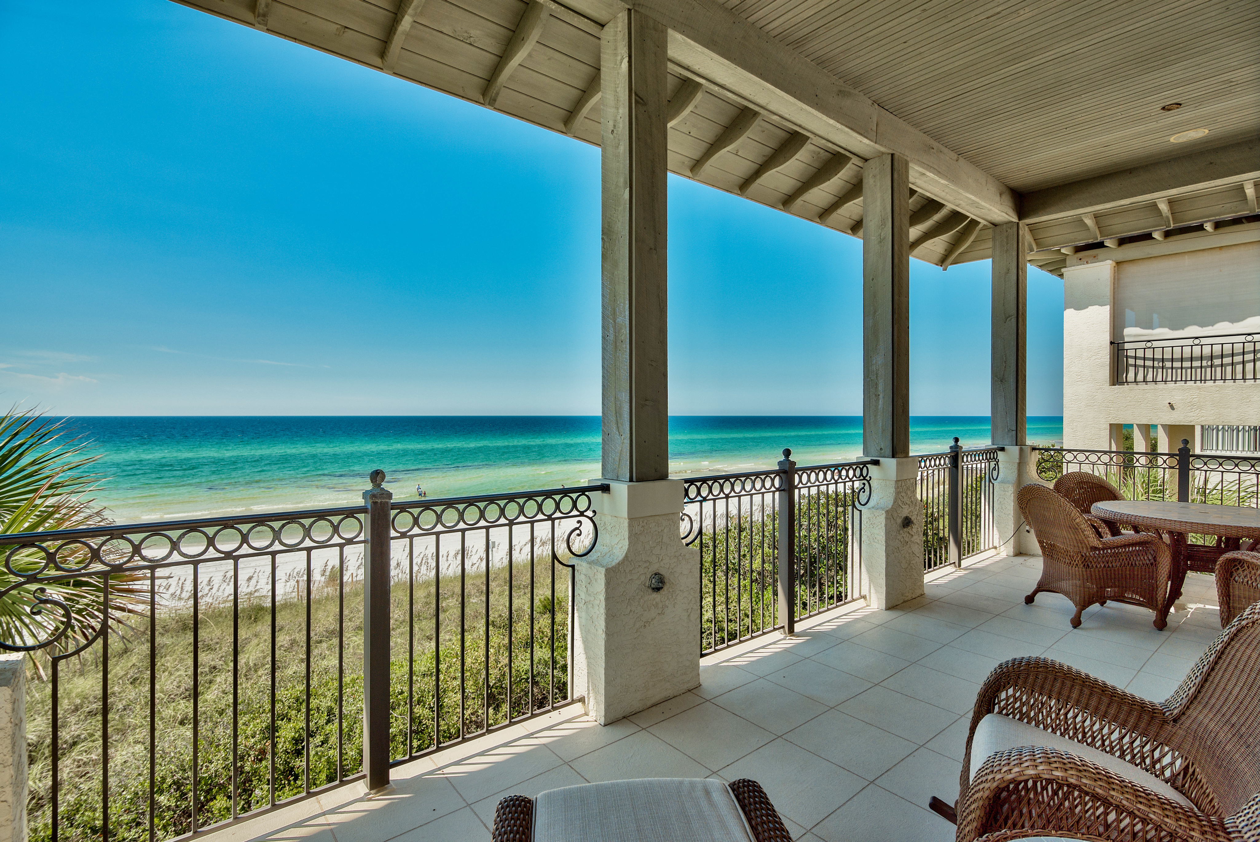 A wide open view of the gulf from the balcony of a gulf front Vizcaya home on a blue sky day